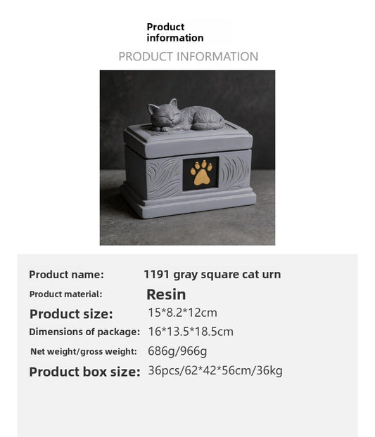 Gray square resin pet memorial urn with sleeping cat on lid and gold paw emblem