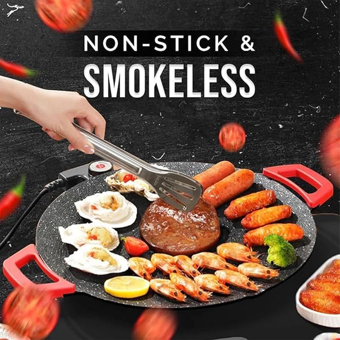 Electric non-stick grill hotplate with red side handles, cooking-ready round pan