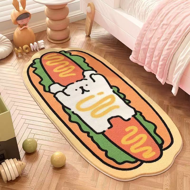 Beige oval bedroom mat with three cartoon puppy faces in orange and green