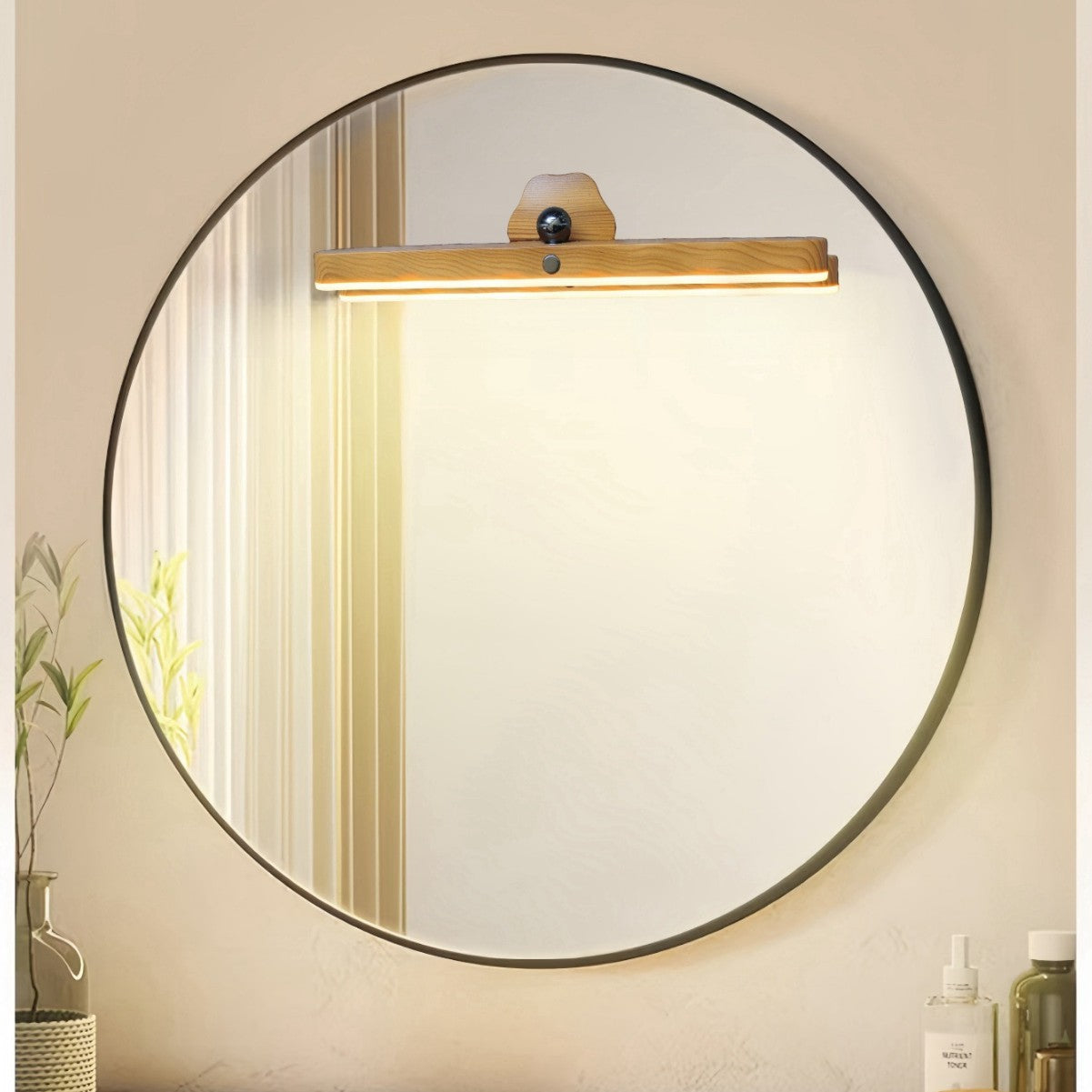 Rotating LED vanity light bar with wood mount, mounted above round mirror
