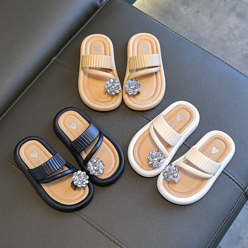 Kids' flip-flop slippers set: black, cream, and white pairs with rhinestone flower details