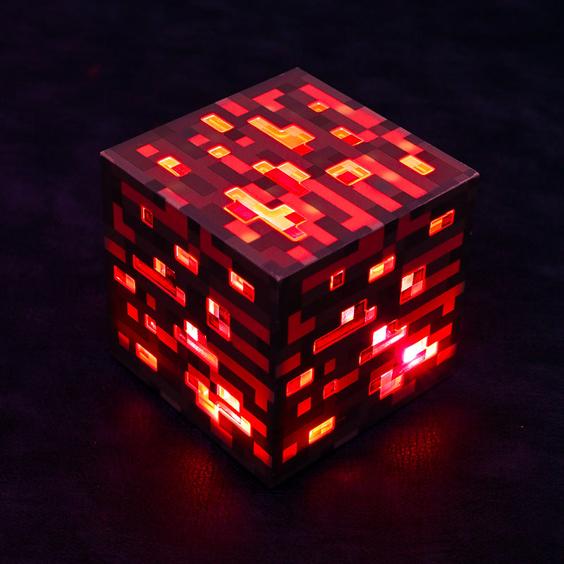 Glowing red pixel Minecraft-style cube night light with dark red side panels