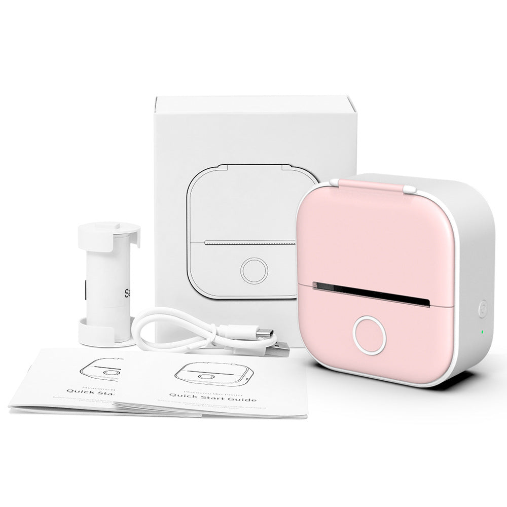 Pink mini thermal label printer kit with box, cables, and thermal paper rolls