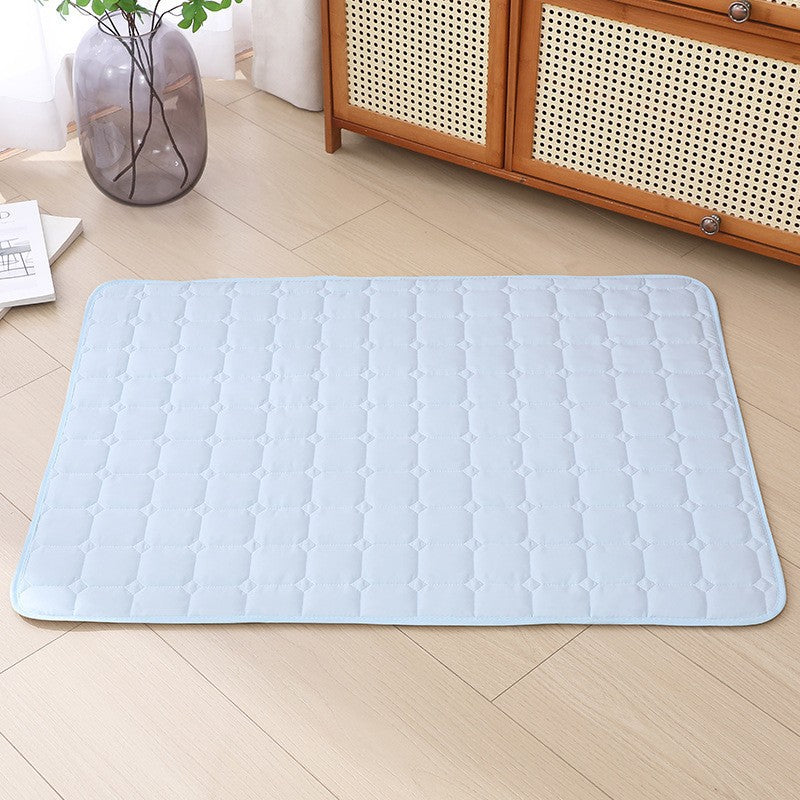 Light blue ice silk cooling mat with raised pebble texture and stitched edges