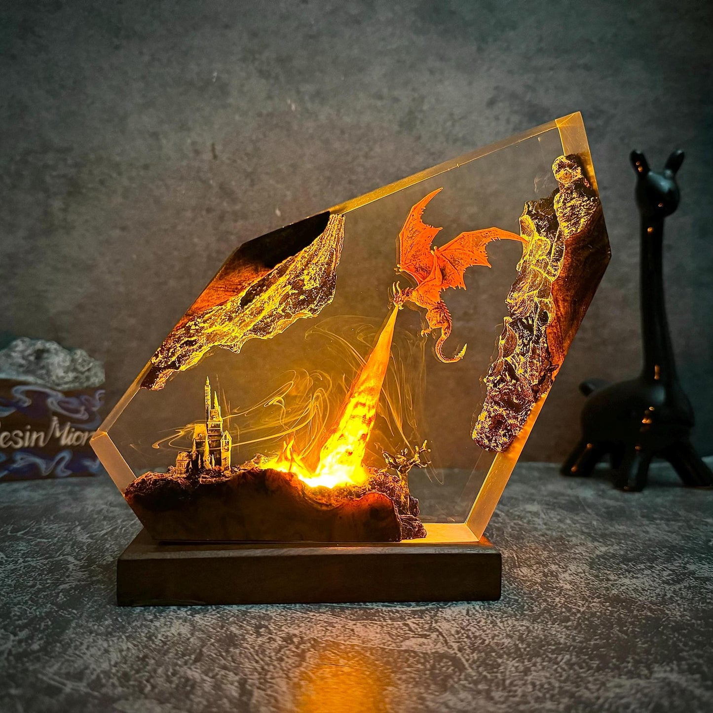Fire dragon resin art lamp glowing orange, dragon silhouette with city ruins in clear frame