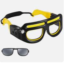 Black and yellow LED headlamp glasses with glowing light bars and spare dark lenses