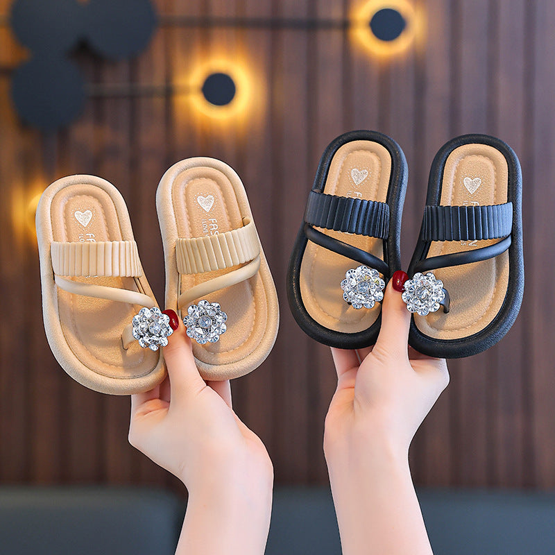 Girls' flip-flop slippers, cream and black straps with rhinestone flower embellishments