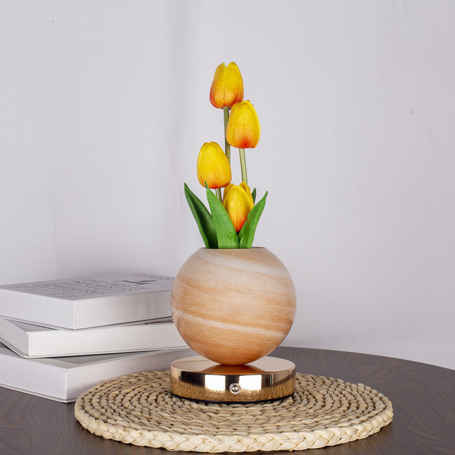 LED tulip night light with glowing yellow tulips in light wood tone spherical pot