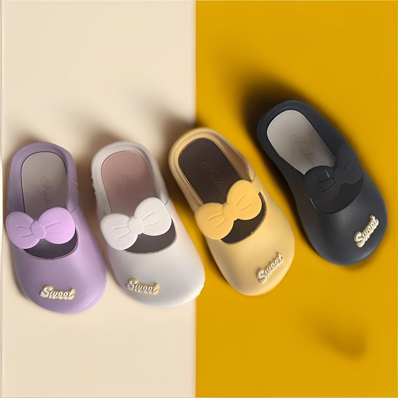 Girls' bow indoor slippers set in purple, white, yellow, and black with soft non-slip soles