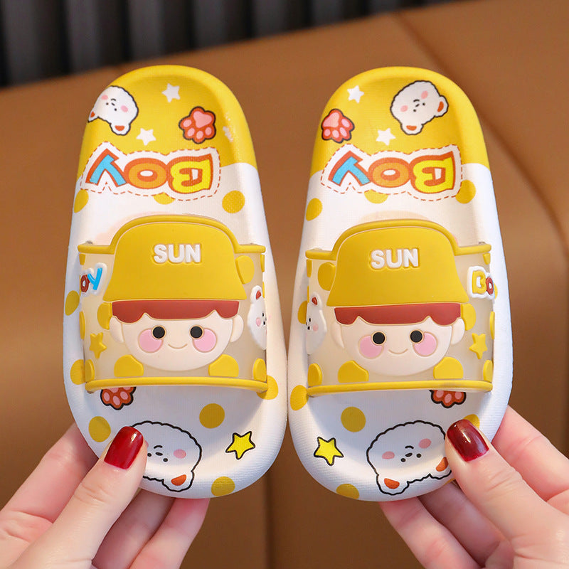 Yellow cartoon indoor slippers with "SUN" panel, kids faces, and soft slide strap