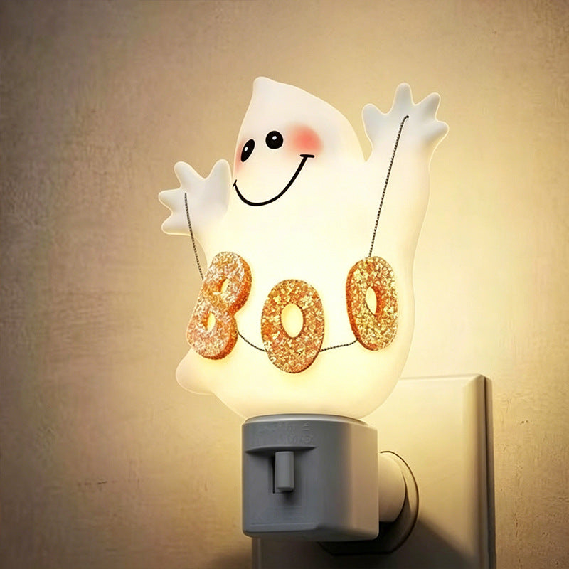 Glowing ghost night light with '80' glitter letters and dangling strings, wall plug