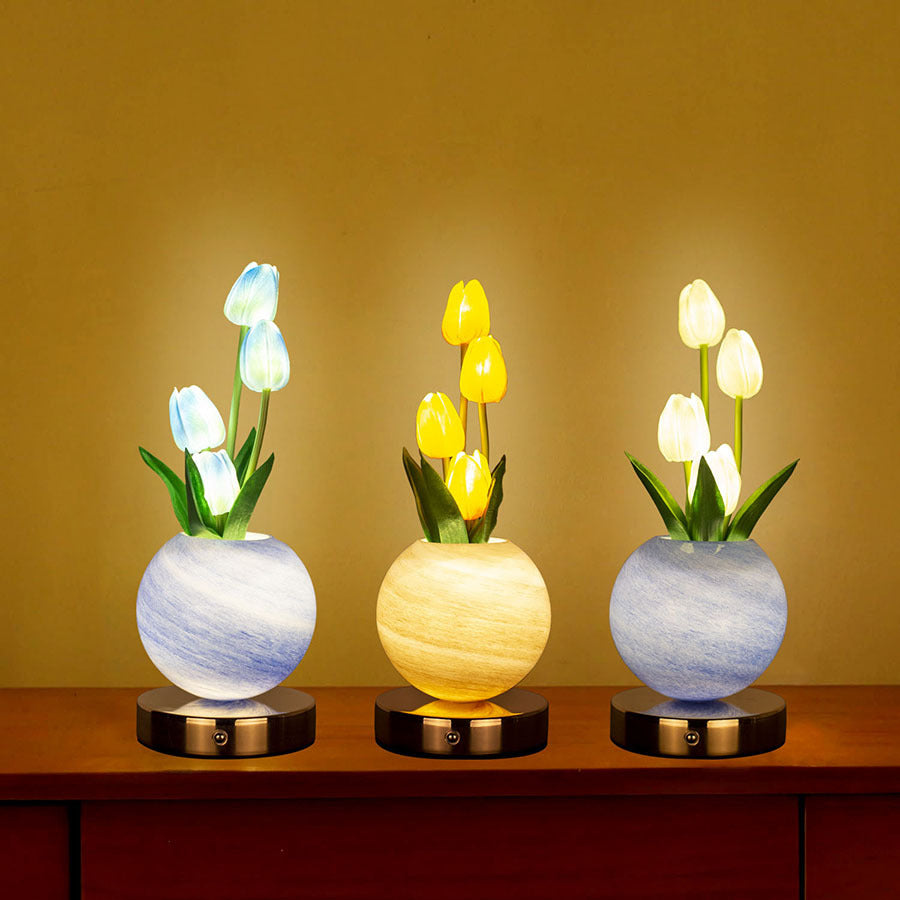 LED tulip night light set with glowing tulips in gray and yellow pots on round base
