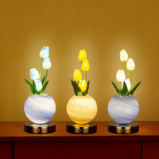 LED tulip night light set with glowing tulips in gray and yellow pots on round base