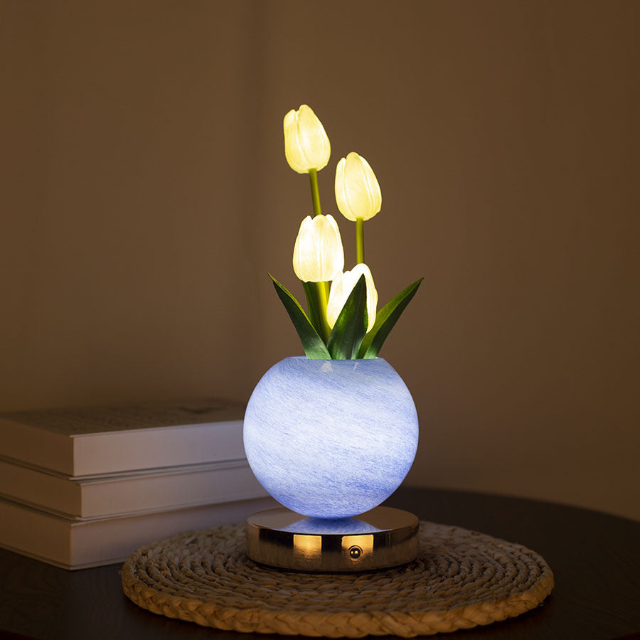 LED tulip night light with glowing yellow tulips in light blue spherical pot