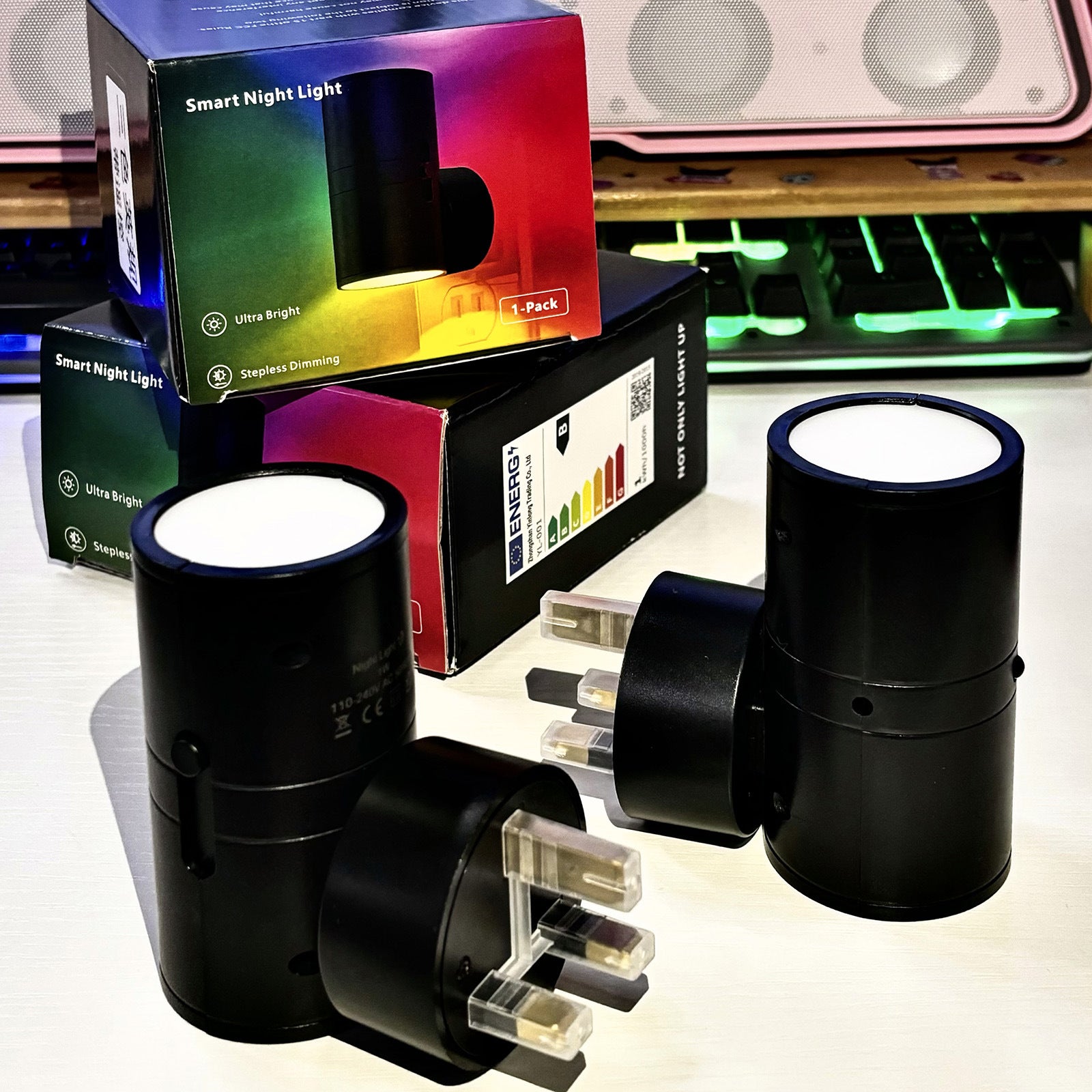 Set of black LED smart night lights with motion sensors and white glow on surfaces