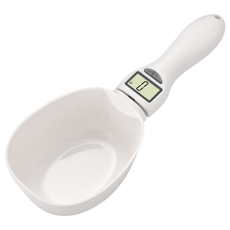 White digital electronic weighing spoon scale close-up with LCD weight display