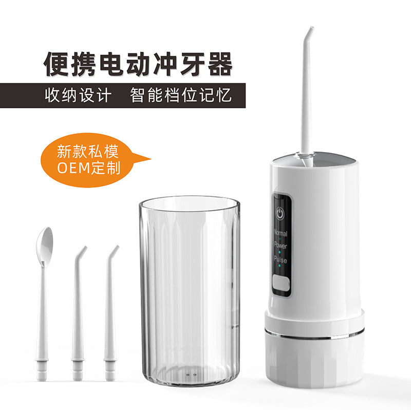 White rechargeable water flosser with press-button control and two nozzle tips