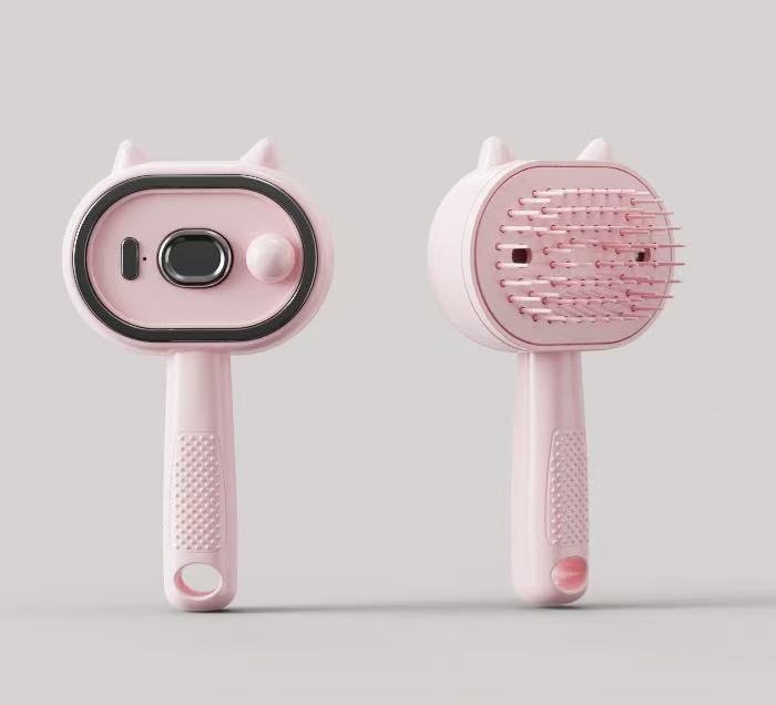 Pink electric spray hair comb with cat-ear sprayer base and rounded brush head