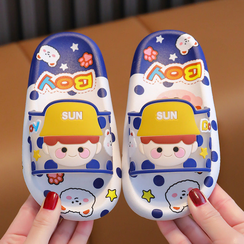 Dark blue cartoon indoor slippers with yellow "SUN" panel and kids faces, soft slide