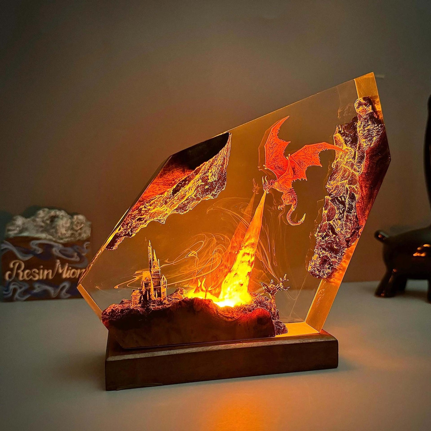 Fire dragon resin art lamp with bright orange core, winged dragon silhouette in clear frame