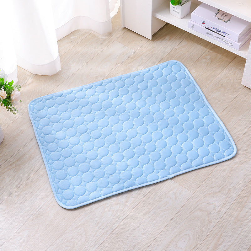 Light blue ice silk cooling mat with raised drop pattern and stitched border