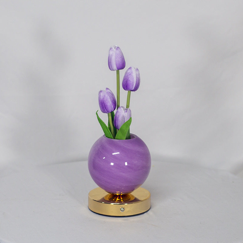 LED tulip night light with glowing purple tulips in purple spherical pot