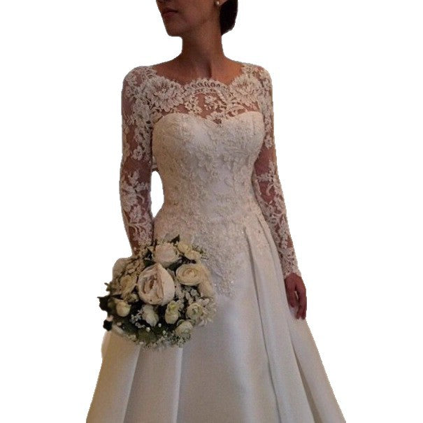 Ivory lace long-sleeve wedding dress with structured bodice, tapering waist, full skirt