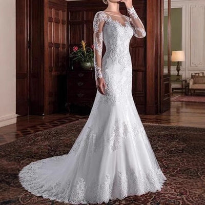 White mermaid wedding dress with lace illusion sleeves and long lace train
