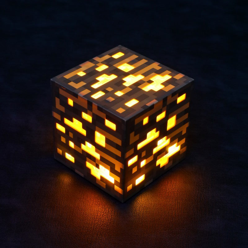 Minecraft-style LED block night light, warm amber glowing pixel cube
