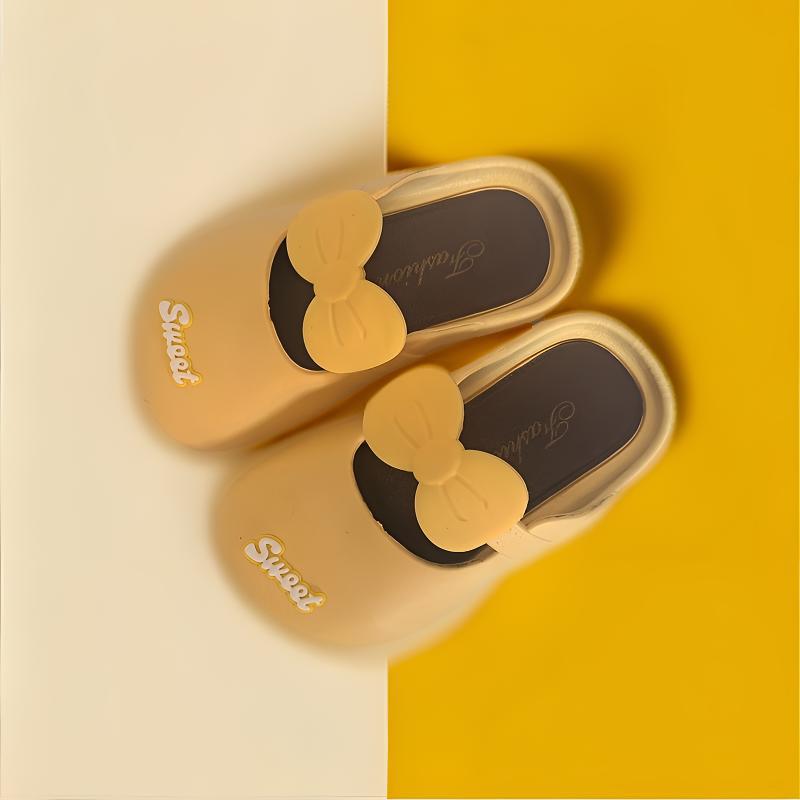 Girls' princess bow indoor slippers, yellow with black trim and oversized bow detail