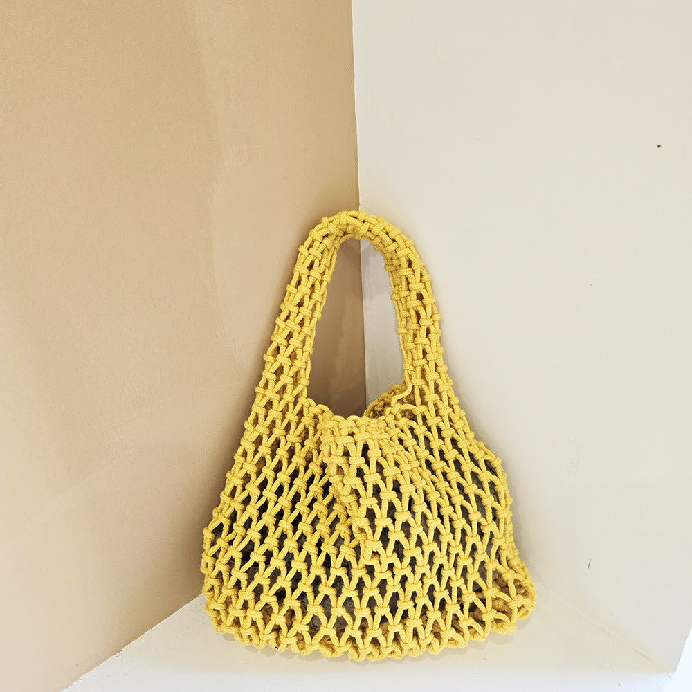 Yellow woven cotton rope bucket bag with openwork net mesh and loop handle