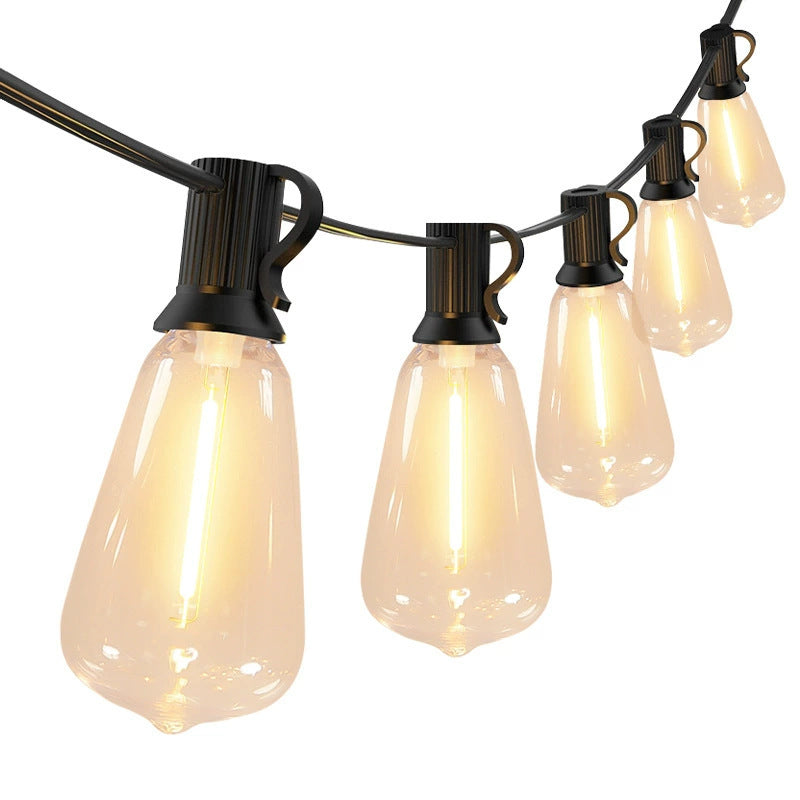 Outdoor LED lamp string with amber-glowing teardrop bulbs on black cable, hanging set