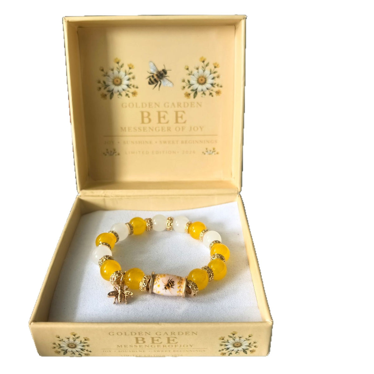 Beaded lucky bracelet with yellow beads, golden accents, and small bee charm on elastic