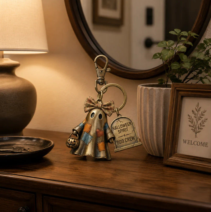Halloween ghost keychain with bronze ring, dangling ghost charm and Boo Crew tag