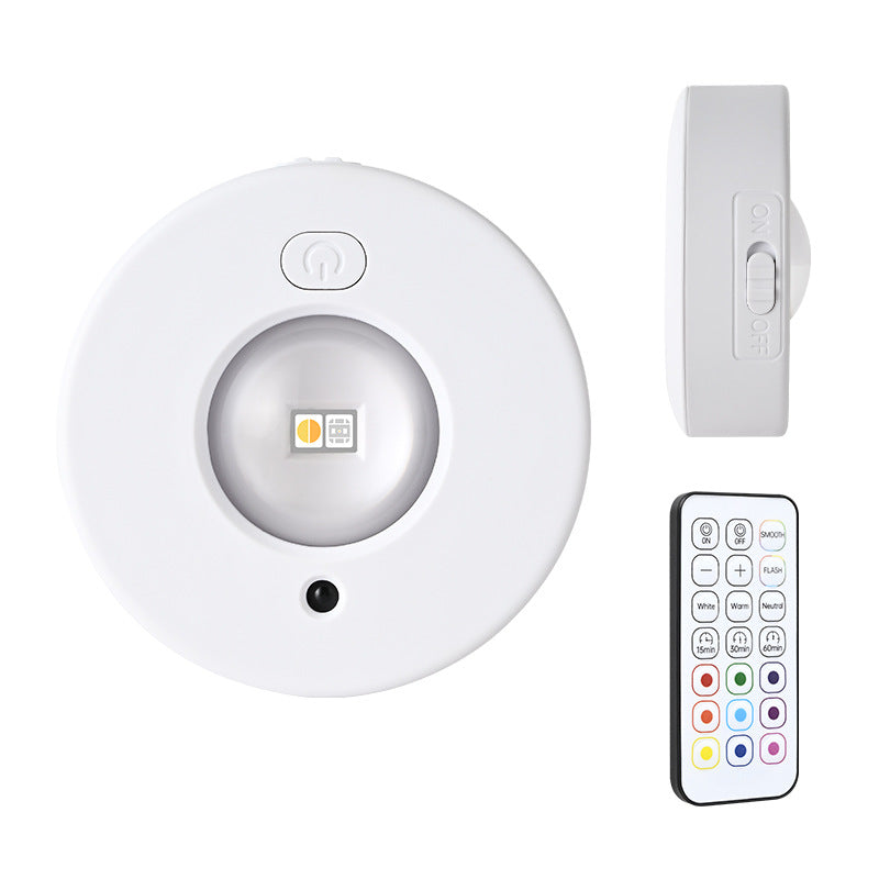 Round white magnetic RGB LED cabinet light with mounting clip and handheld remote