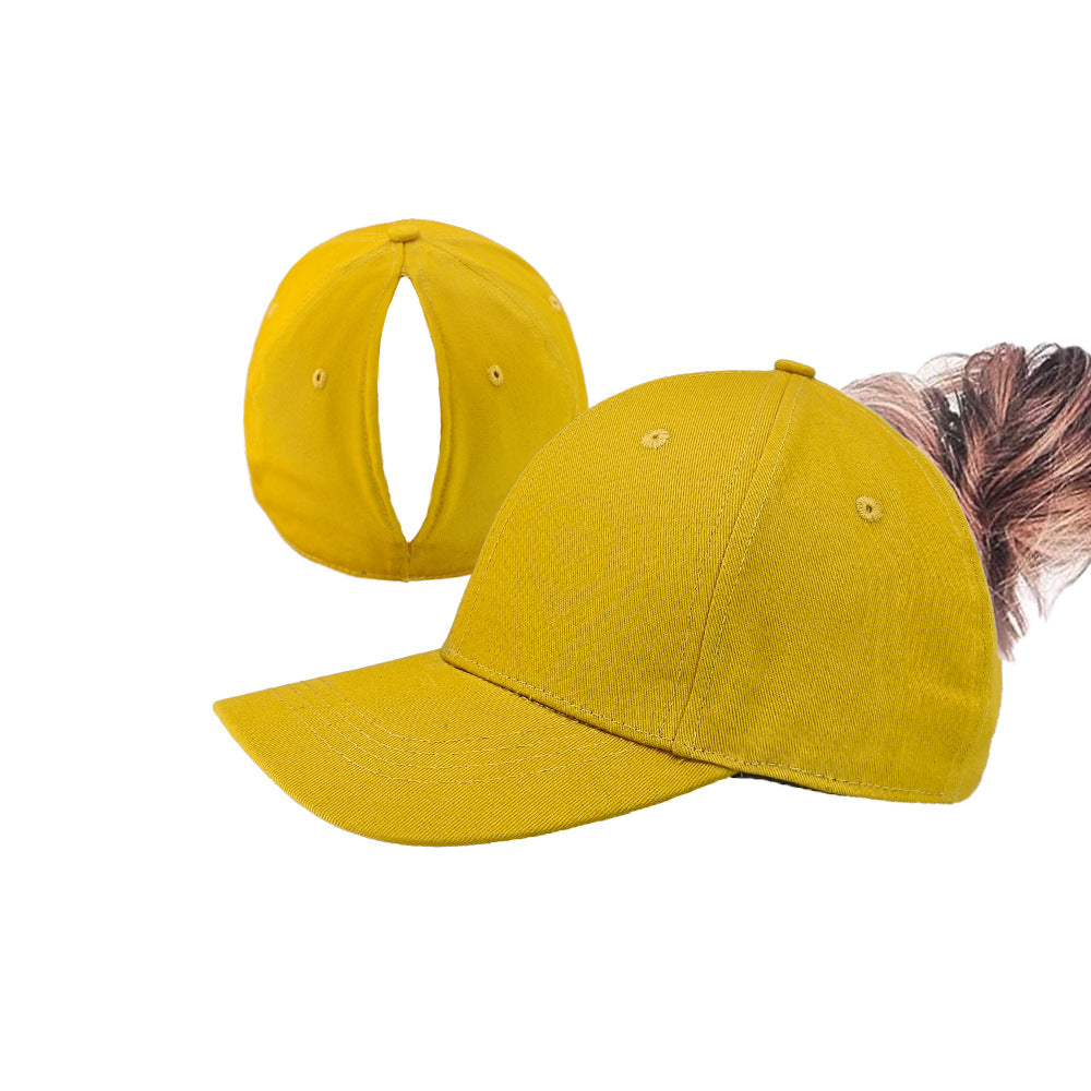 Yellow ponytail baseball cap with open back and curved brim
