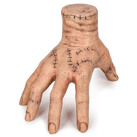 Halloween severed hand prop, flesh-toned with stitched wrist and stitched fingers.