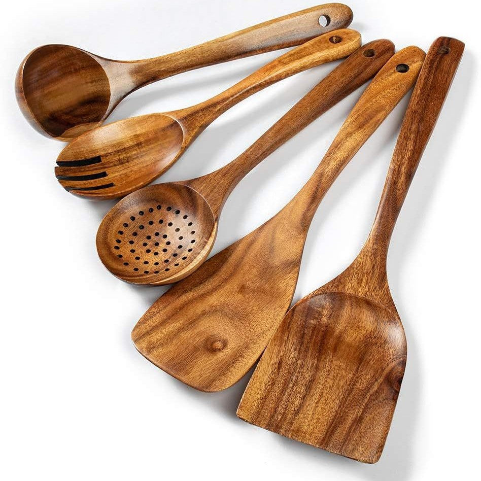 Wooden cooking utensil set with ladles, spatulas, and perforated strainer spoon