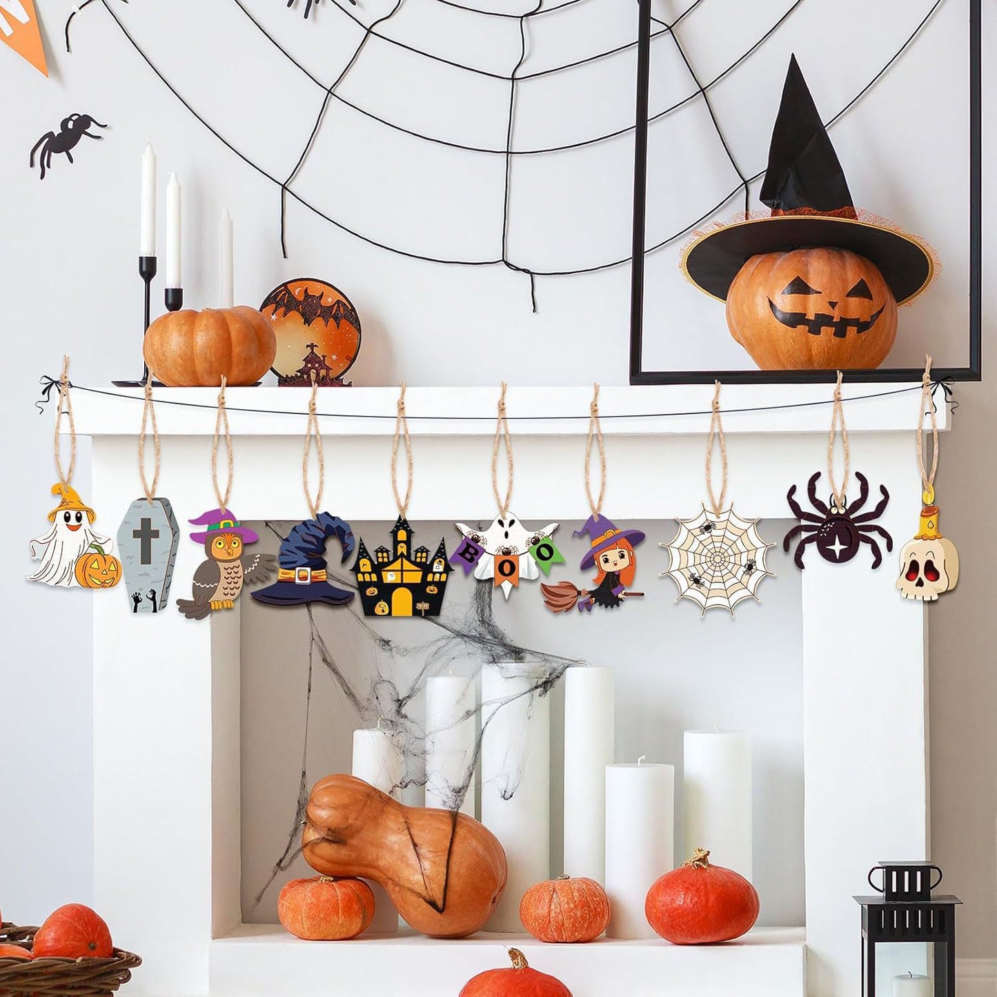 Halloween hollow wood hanging decorations on twine strings: jack-o-lantern, witch, spider web