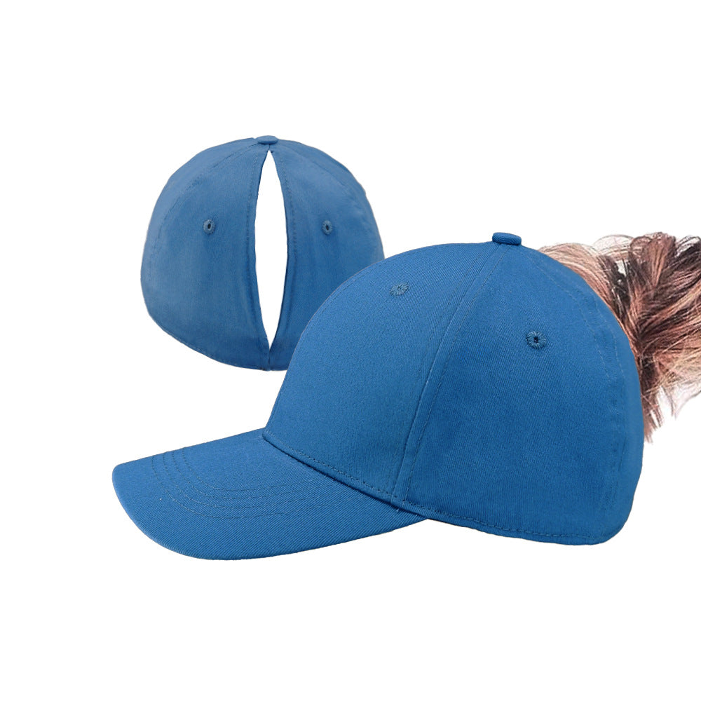 Blue ponytail baseball cap with open back and curved brim