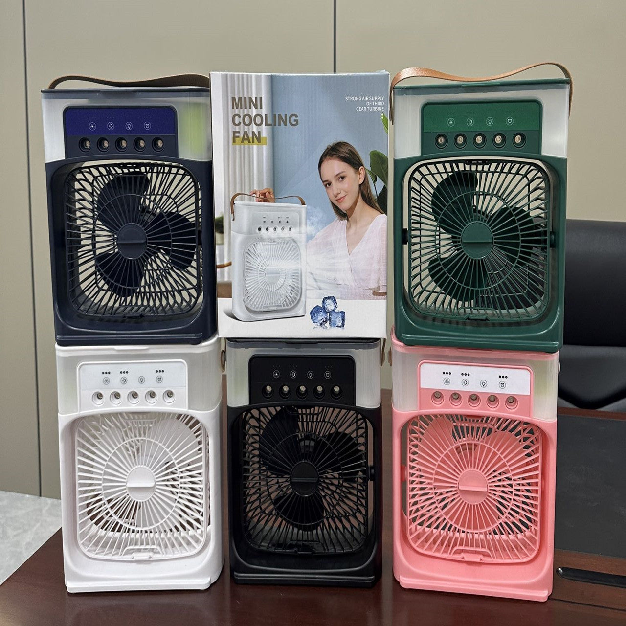 Desktop mist cooling fan set showing white, black, and green units