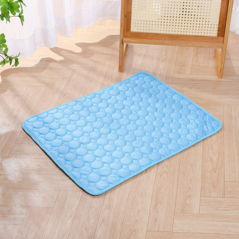 Sky blue ice silk cooling mat with raised drop pattern and rounded corner shape