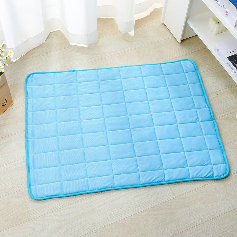 Blue ice silk cooling mat with grid stitching and raised pebble texture