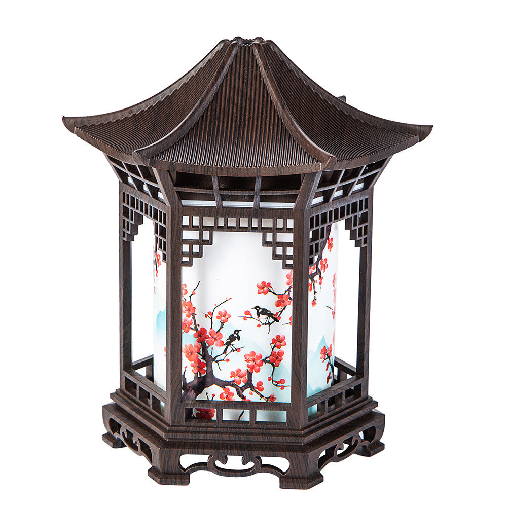 Humidifier night light lantern in dark wood with glowing interior and mist effect