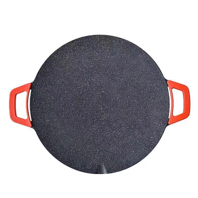 Dark speckled non-stick electric baking tray with red handles, circular cooking plate