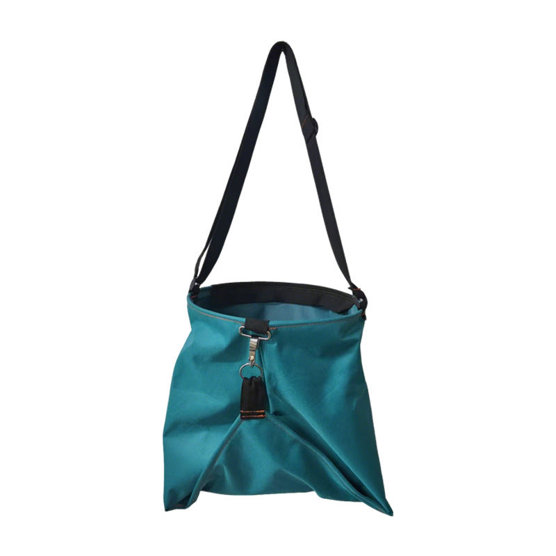 Teal hanging garden tool bag with adjustable shoulder straps and clasp front pocket