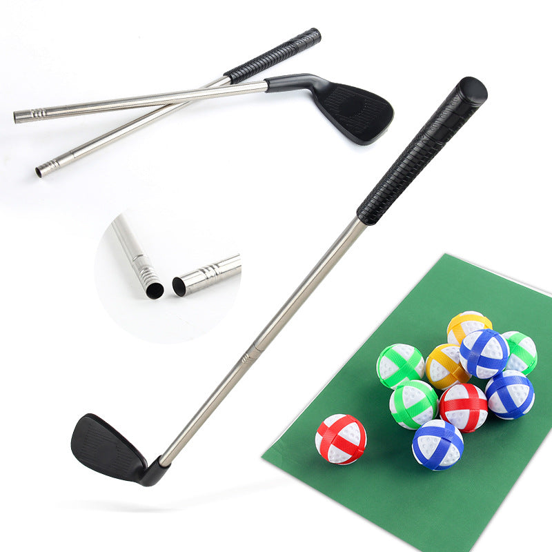 Children’s golf practice set with putters, ball rack, and green target mat