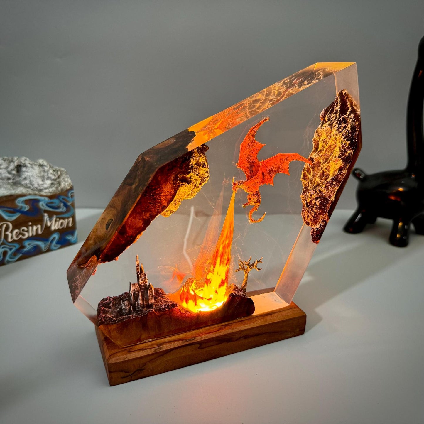 Fire dragon resin art lamp with glowing orange flames inside angled clear frame