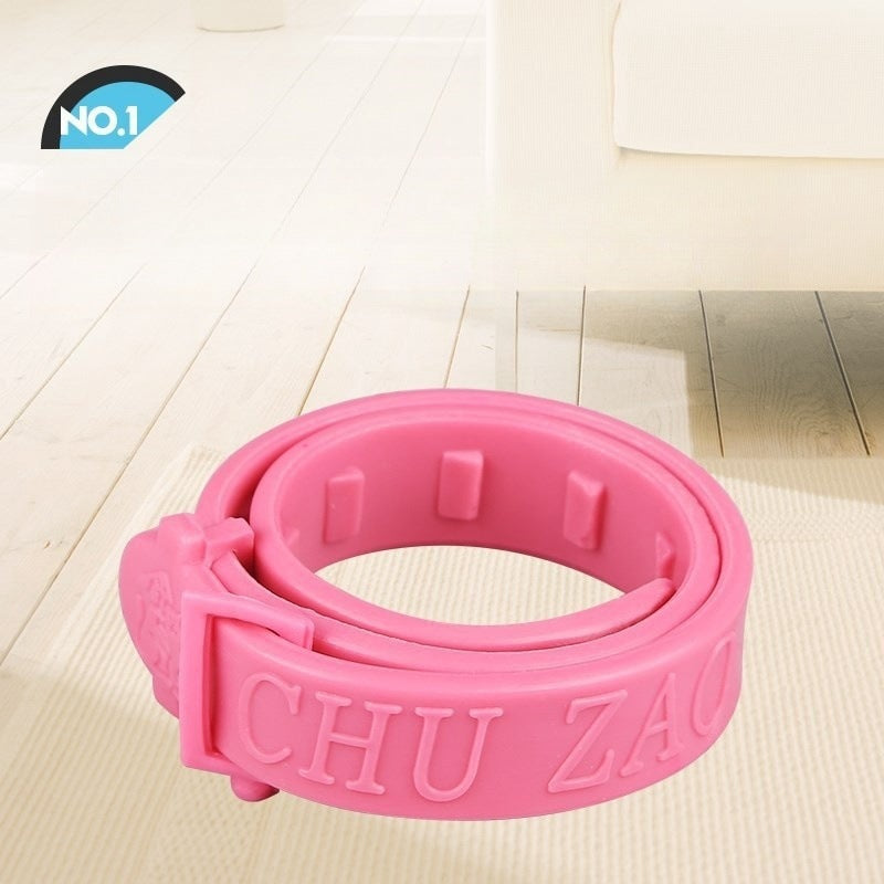 Pink pet flea and tick repellent collar with embossed lettering on band