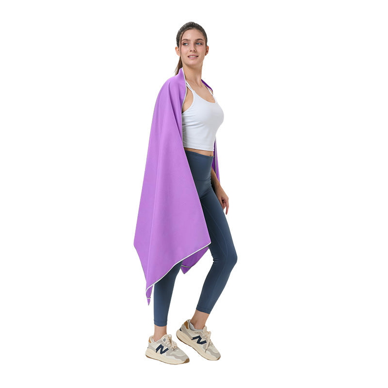 Quick-dry microfibre beach towel, purple, draped over a person